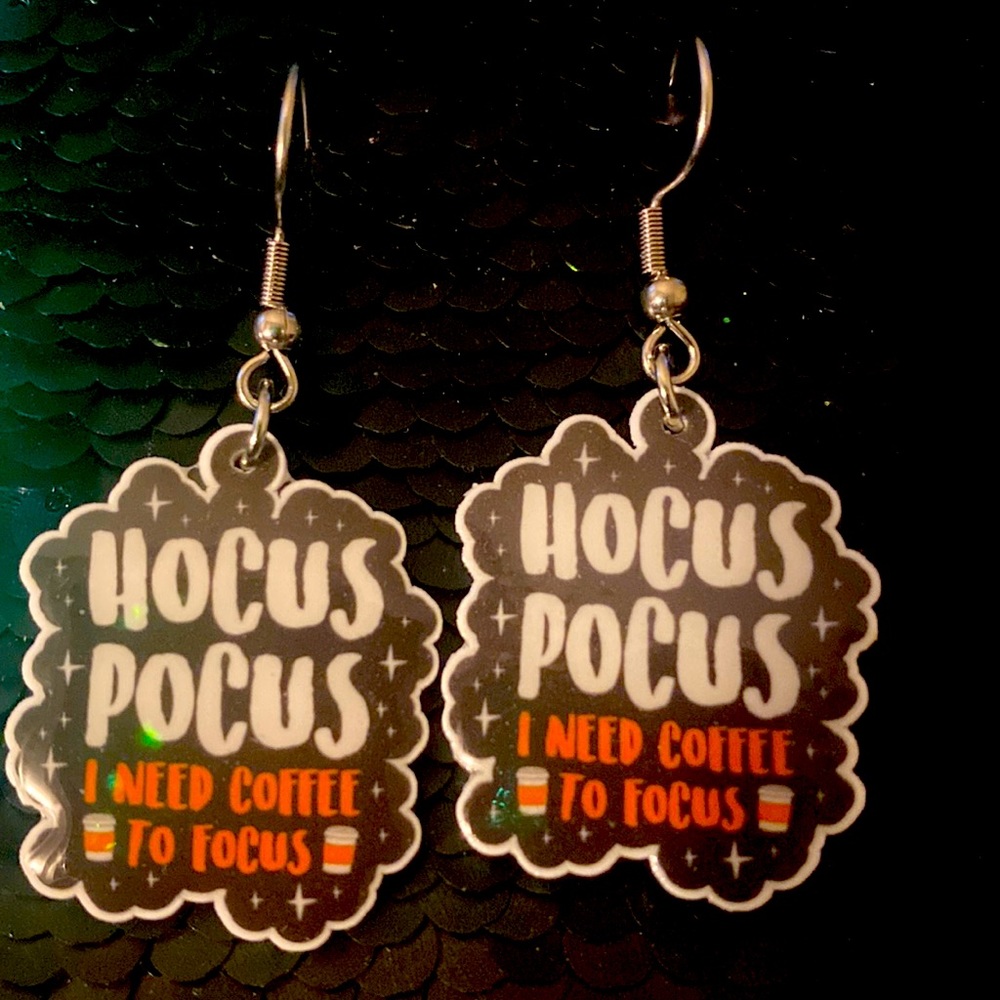 Cute hocus pocus silver tone earrings that says I need coffee to focus